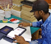 Phumani Archival Mill product developer and papermaker Sipho Mabaso fits the handmade archival packaging he crafted for an artist’s limited edition sketchbook range. Photo: Supplied